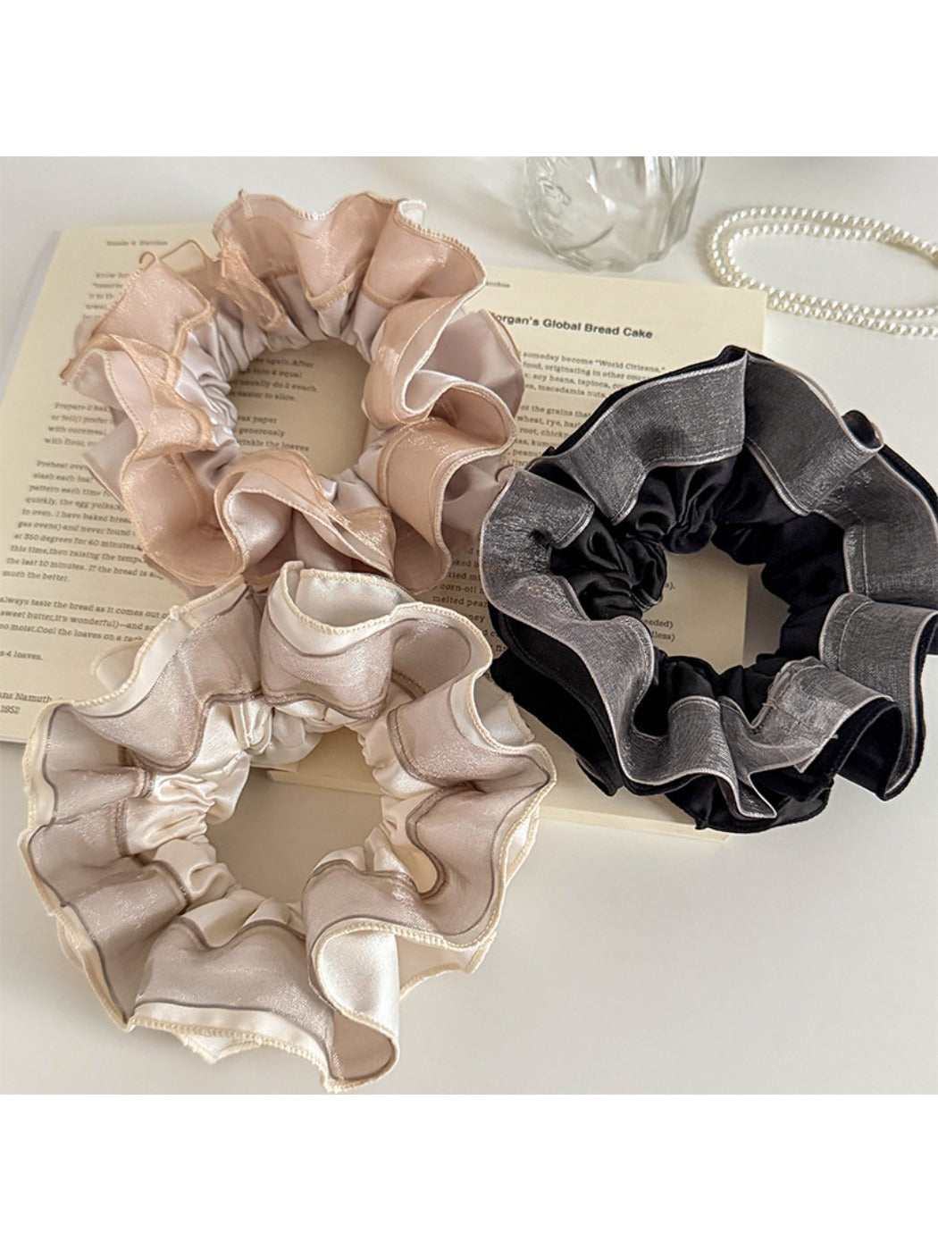 Close-up of Gifty scrunchie showing satin and tulle patchwork details