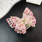 Top view of Beau double layer hollow bow shaped claw clip showing hollow bow detail