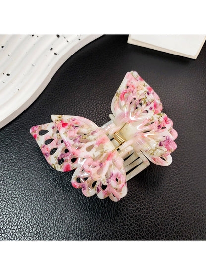 Top view of Beau double layer hollow bow shaped claw clip showing hollow bow detail