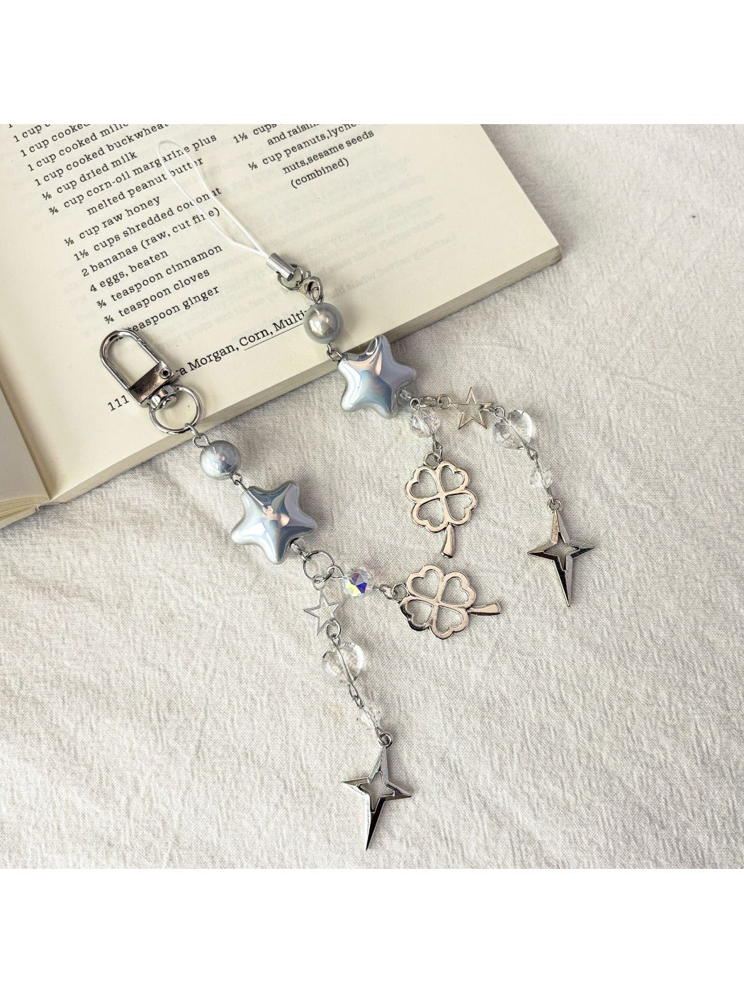 Close-up of iridescent star keychain showing holographic color shifts