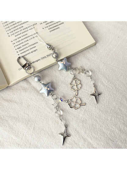 Close-up of iridescent star keychain showing holographic color shifts
