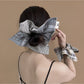 Close-up of Gifty plaid scarf scrunchie fabric texture and pattern