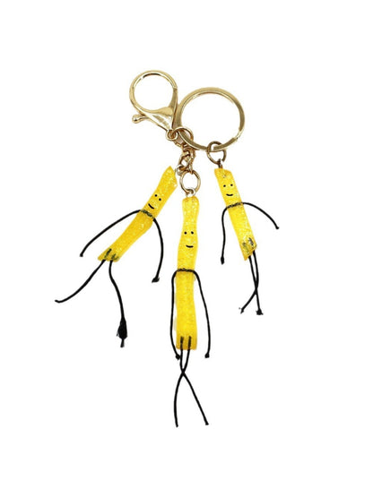 Mini French fries keychain held in hand to show size and detail
