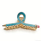 Beau hair clip displayed on a white background highlighting its shape