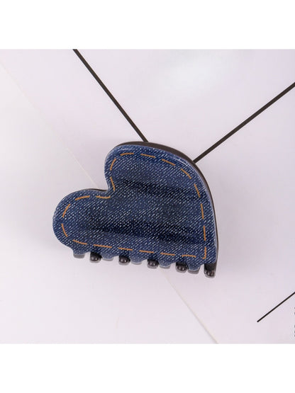 Beau hair clip worn in brown hair, displaying heart design and size