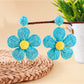 Earedge pastel flower shaped knitted earrings displayed with matching accessories