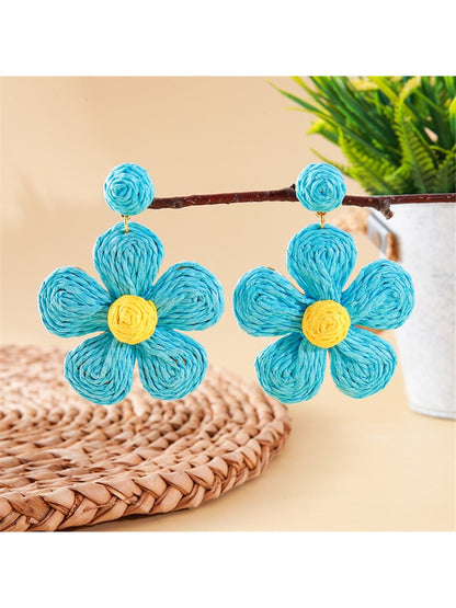 Earedge pastel flower shaped knitted earrings displayed with matching accessories