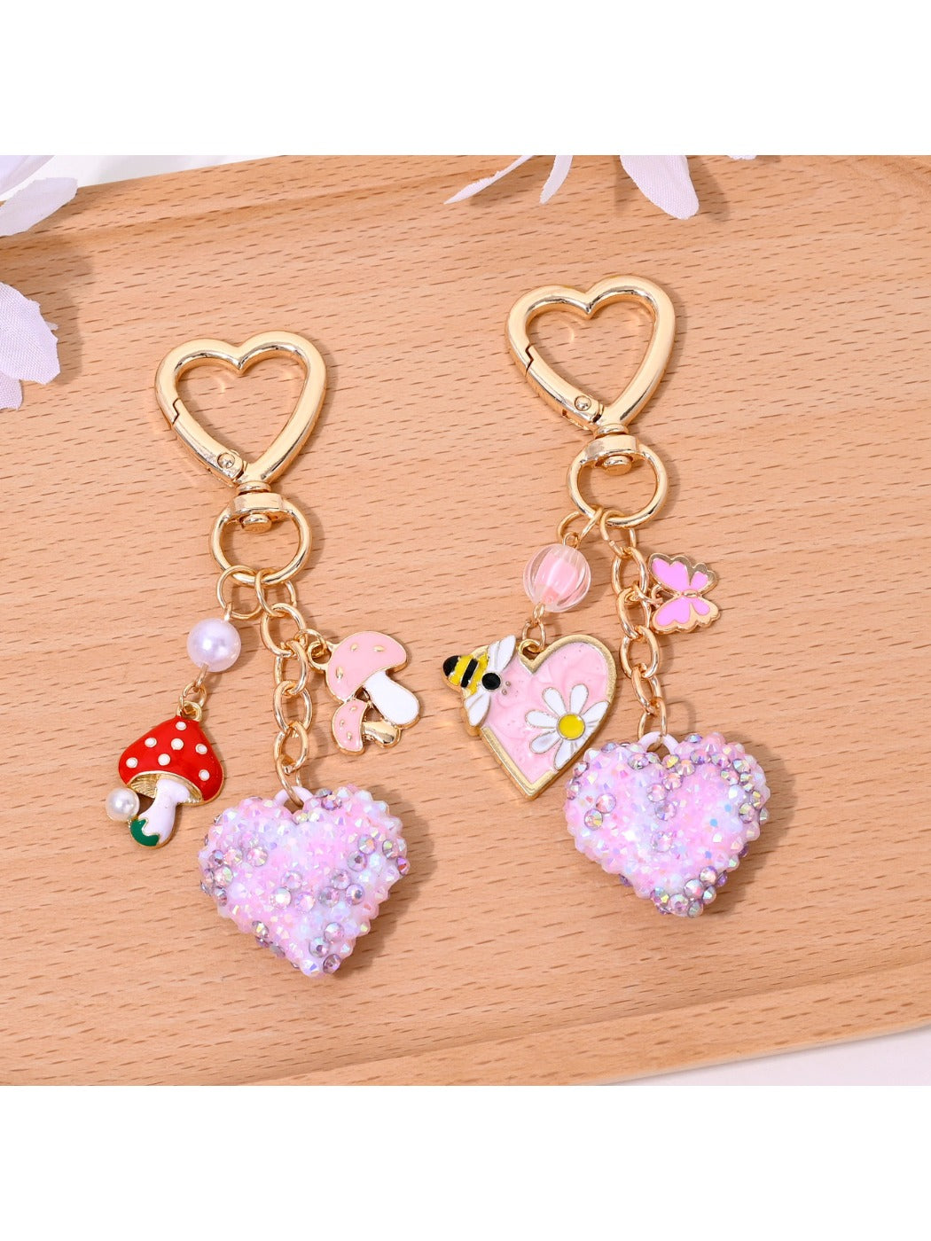 Full rhinestone heart shaped keychain with silver keyring on white background