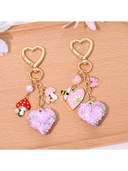 Full rhinestone heart shaped keychain with silver keyring on white background