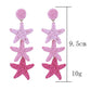 Pair of silver star pendant earrings with delicate chain detail