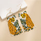 Earedge - Long Animal Shaped Tassel Earrings