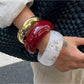 Lovra wide fit bracelet worn on wrist with minimalist outfit