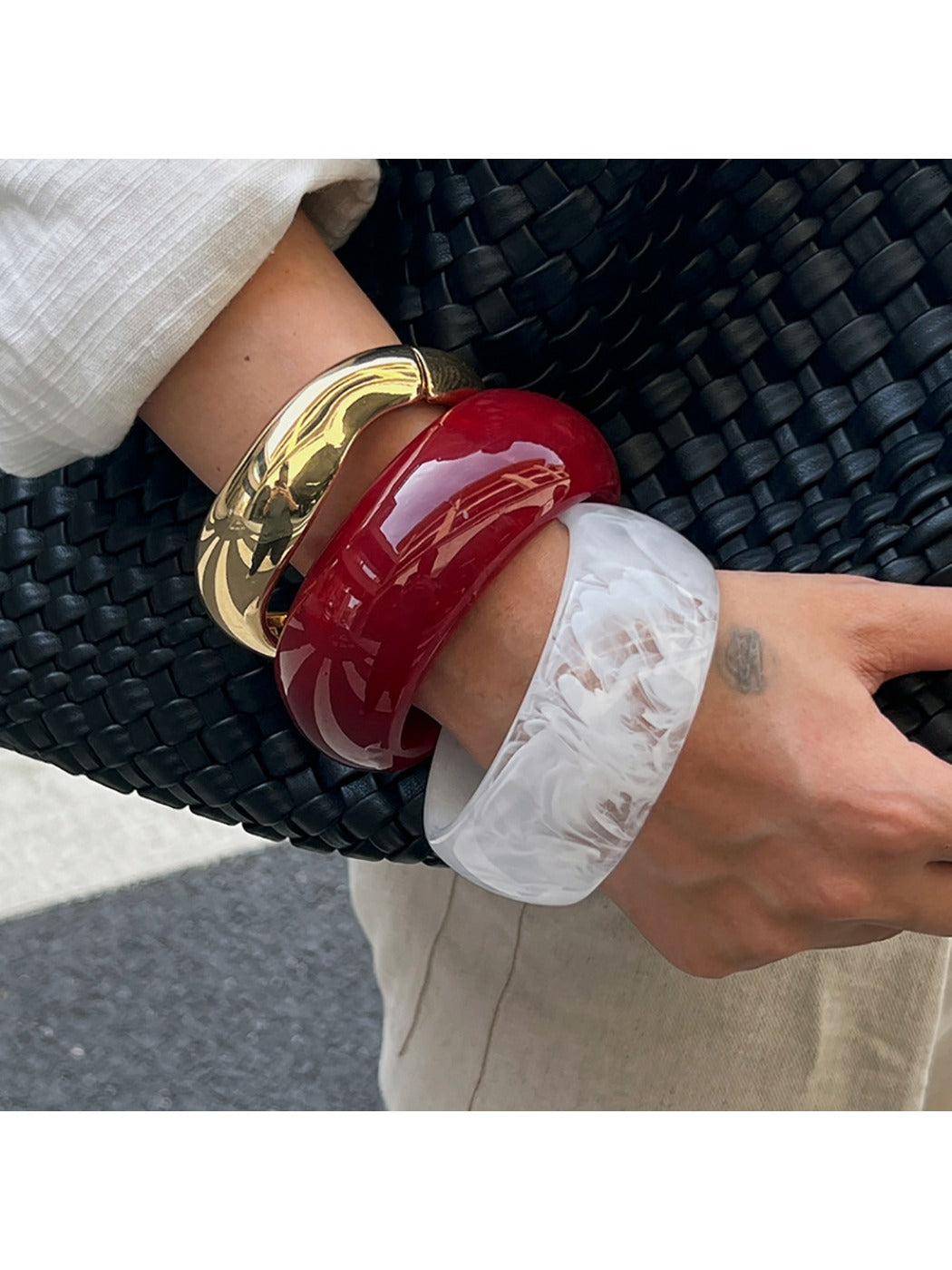 Lovra wide fit bracelet worn on wrist with minimalist outfit
