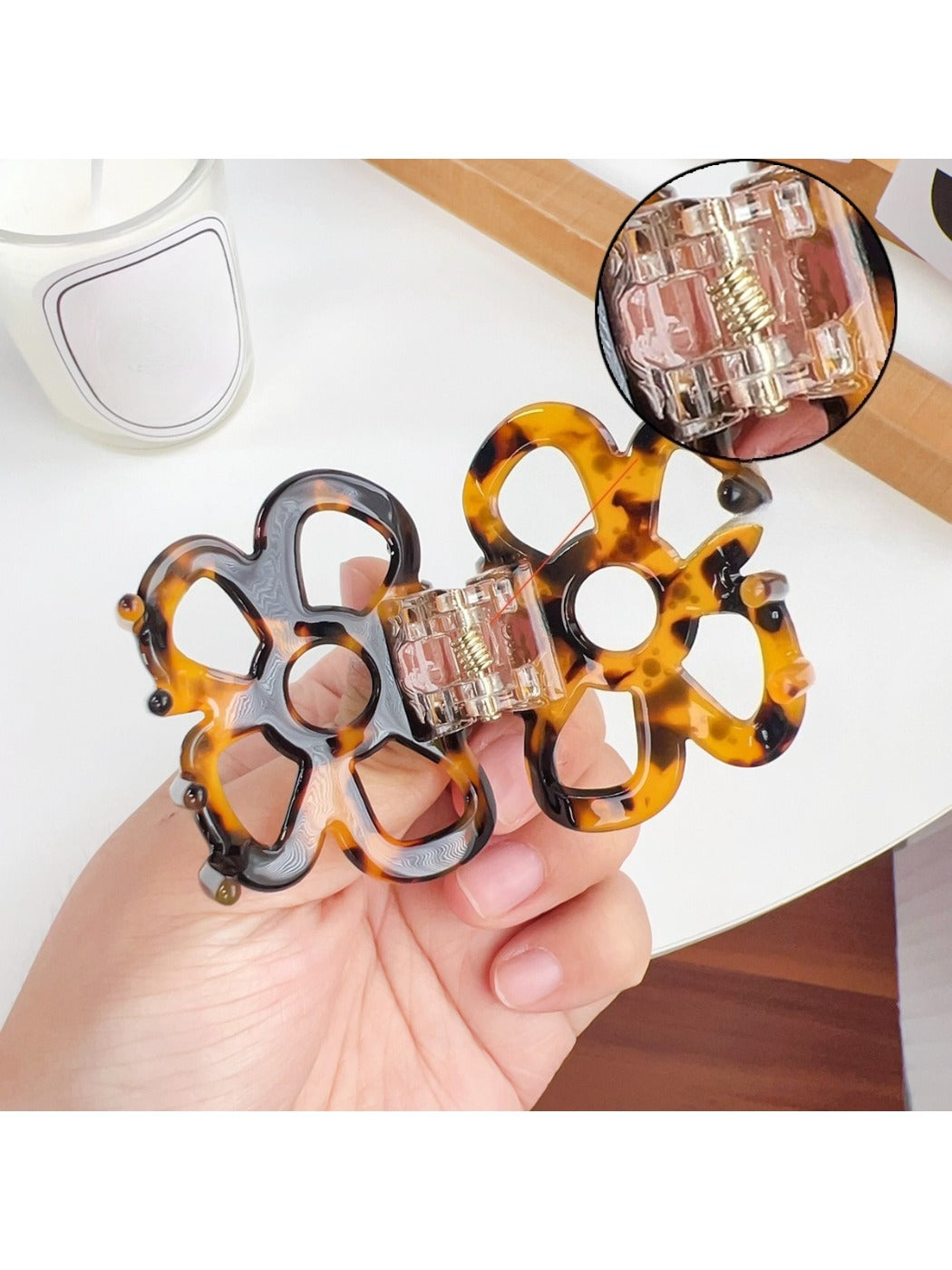 Side view of Beau openwork flower hair claw clip highlighting clip mechanism
