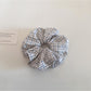 Gifty plaid scrunchie held in hand highlighting its size and pattern