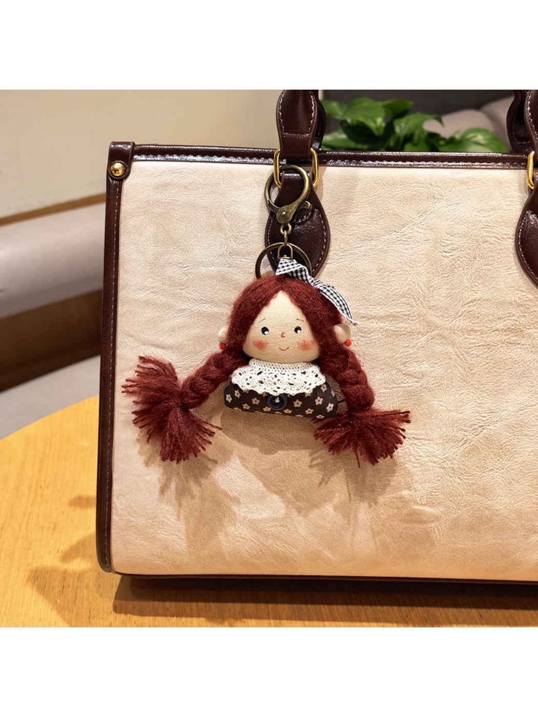 Back view of the vintage girl charm showing the smooth metal finish and attachment loop