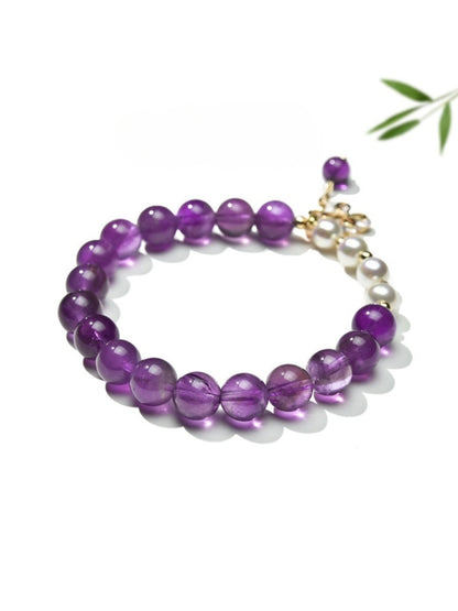 Side view of Lovra vintage butterfly beaded bracelet highlighting bead details and butterfly charm