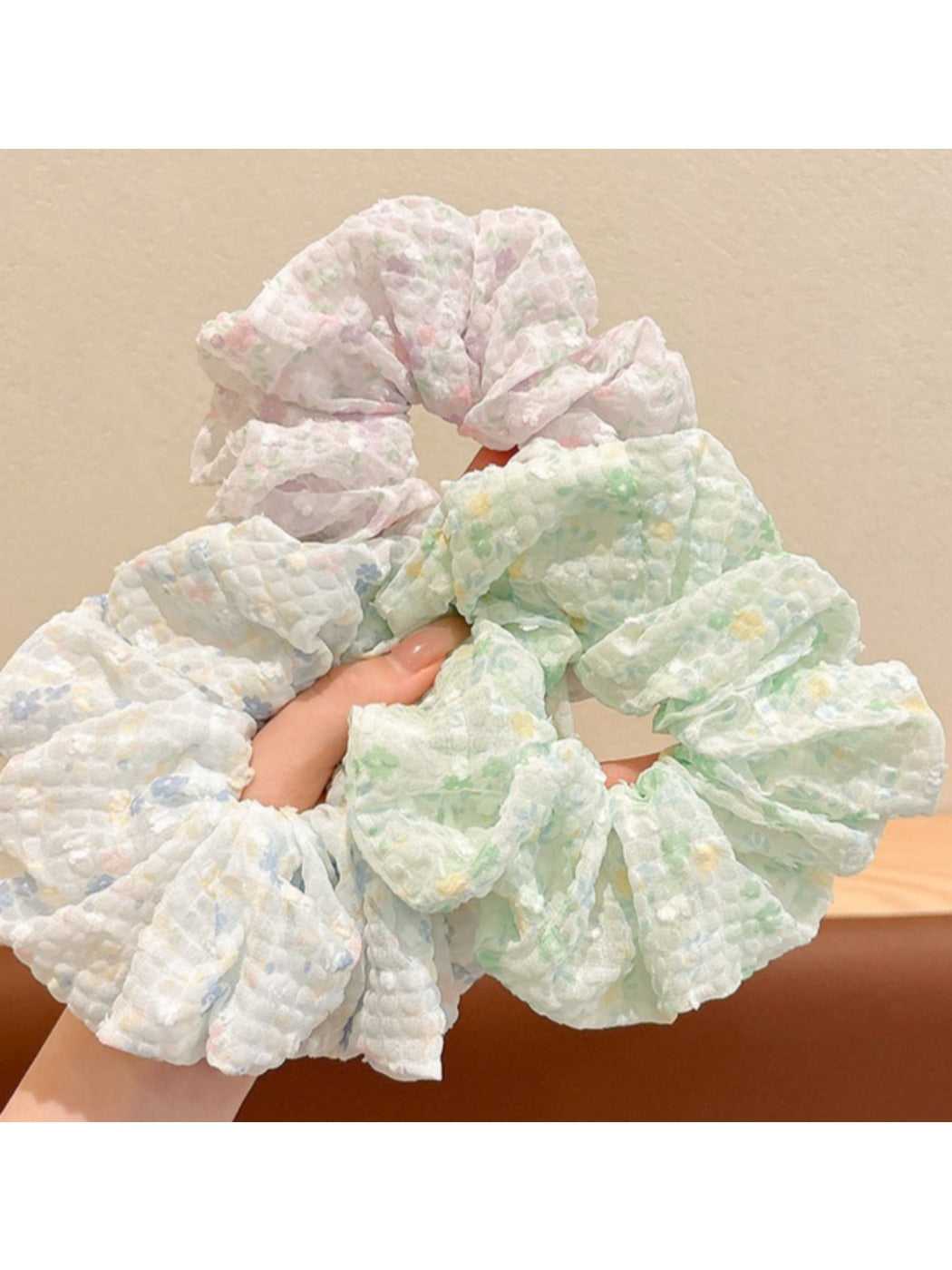 Gifty scrunchie with small floral pattern wrapped around a ponytail