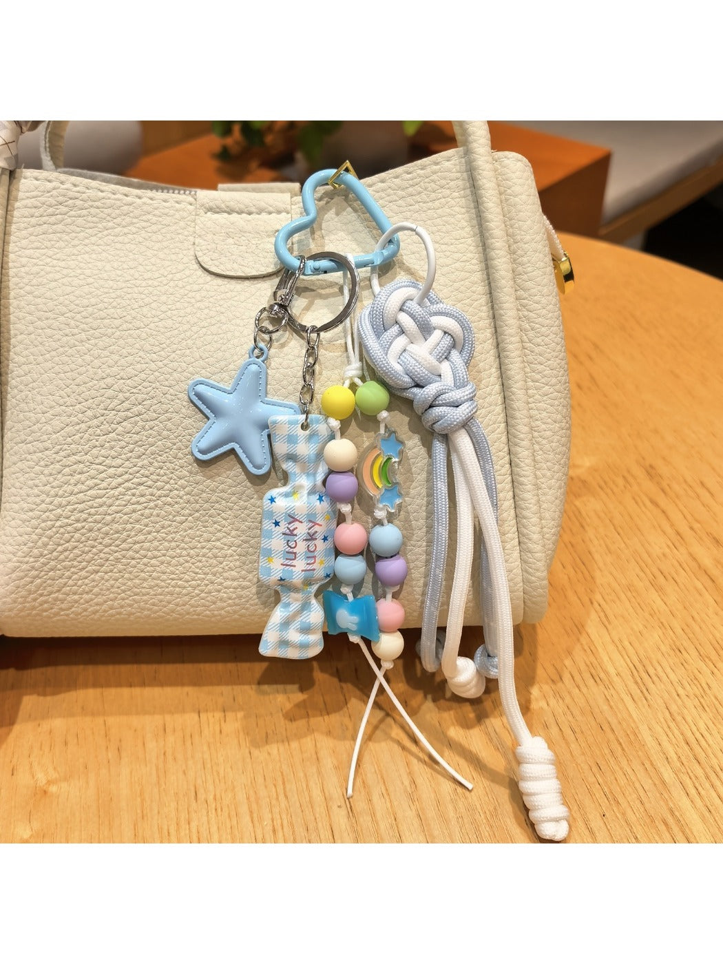 Blue candy star-shaped keychain with a silver keyring on a white background