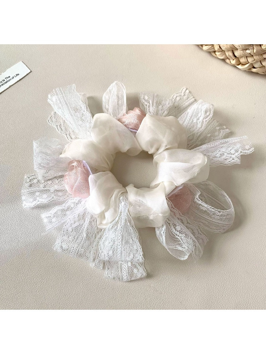 Gifty minimalist floral scrunchie with white and yellow flower pattern on beige fabric
