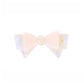 Beau hair clip with bow held in hand to show size and scale
