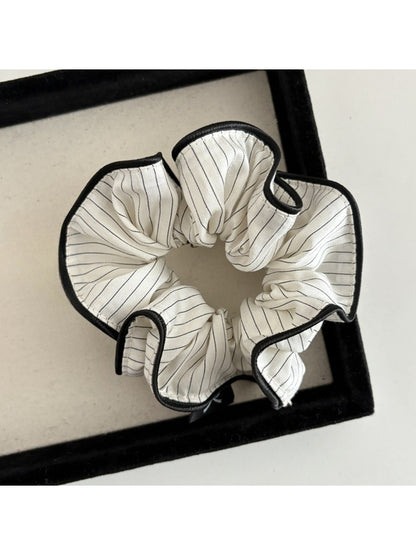 Gifty scrunchie displayed flat to highlight striped pattern and texture