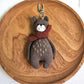 Bear keychain attached to a backpack zipper pull