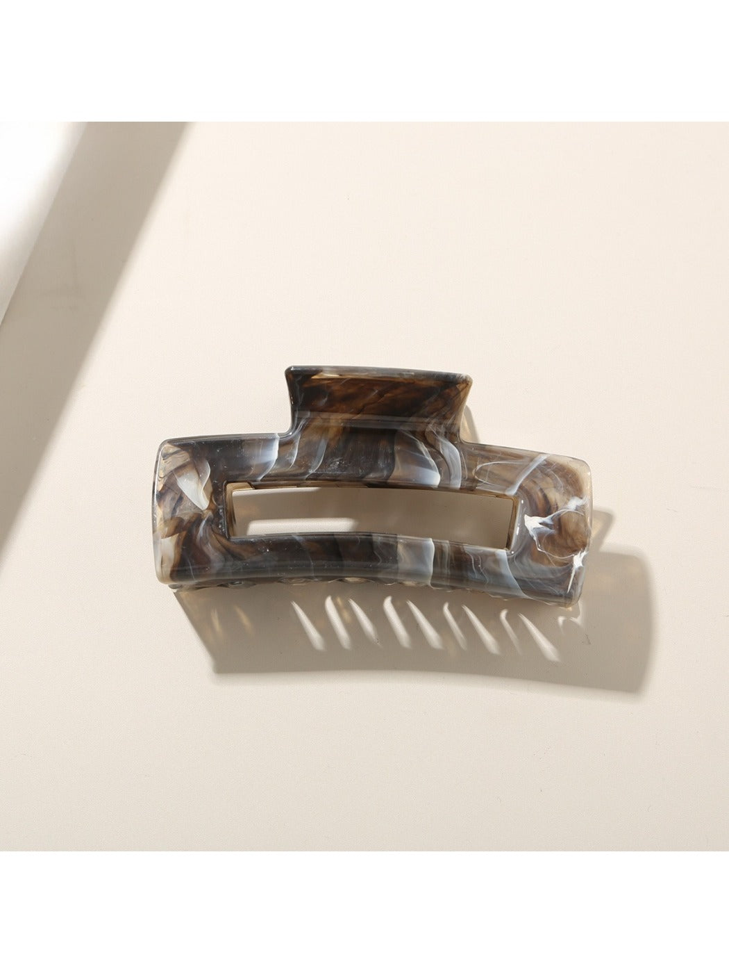 Beau rectangular hair clip worn in long brown hair, securing a half-up hairstyle