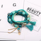Side view of Lovra tassel pendant bracelet displaying bead texture and tassel