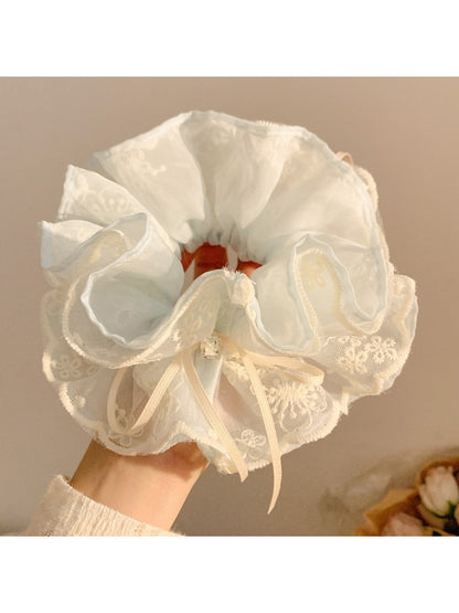 Side view of Gifty double layer tulle scrunchie highlighting volume and fabric