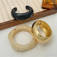 Side view of Lovra polished round bracelet emphasizing its rounded shape