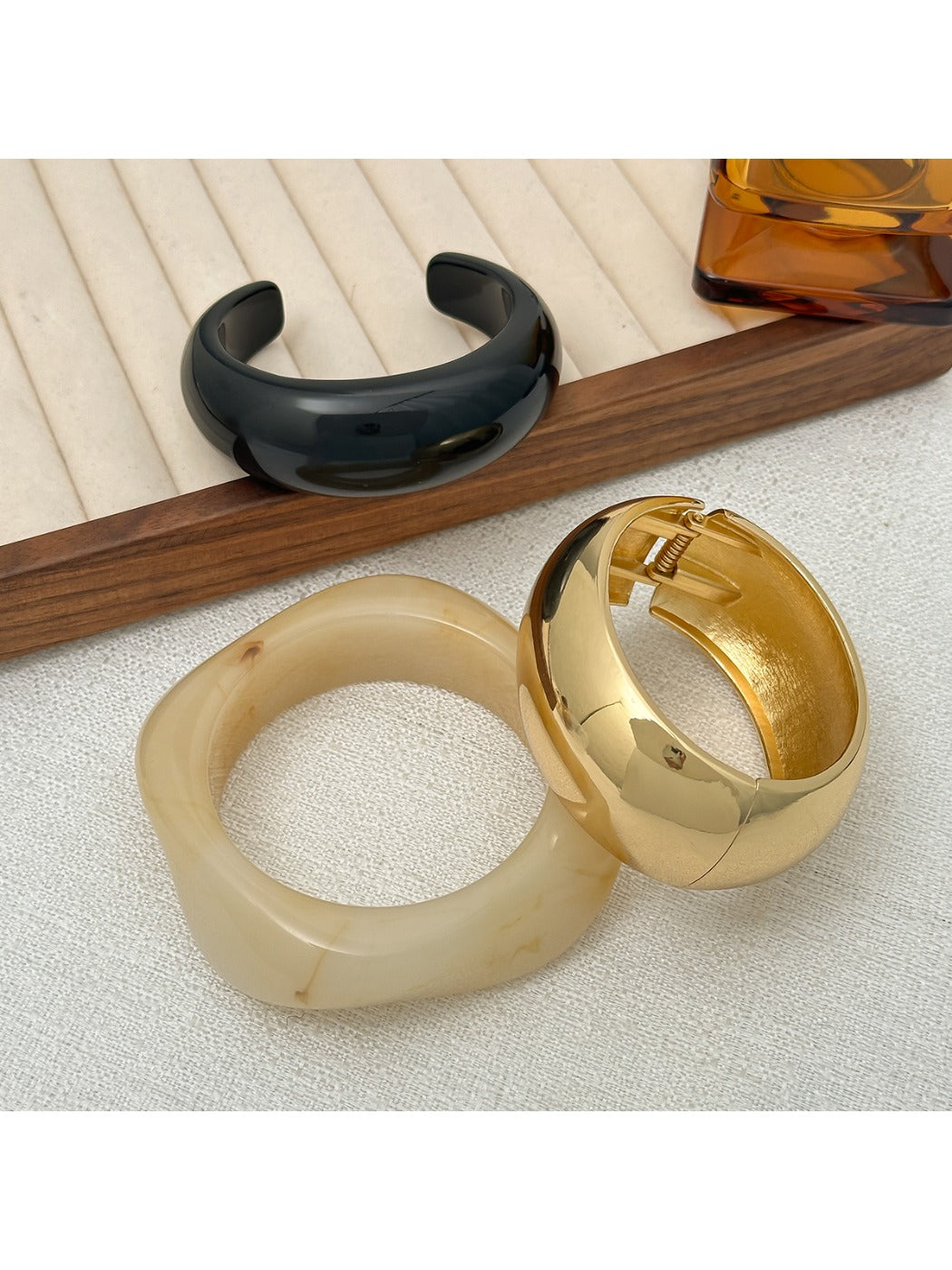 Side view of Lovra polished round bracelet emphasizing its rounded shape