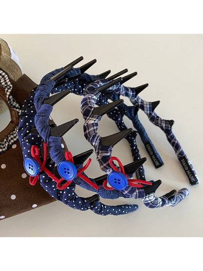 Blue scrunchie made of soft fabric with gathered elastic design
