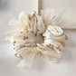 Top view of Gifty tiny floral print bow scrunchie showing fabric pattern