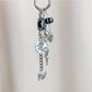 Dancing girl charm keychain attached to a set of keys