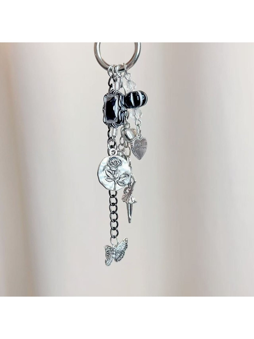 Dancing girl charm keychain attached to a set of keys