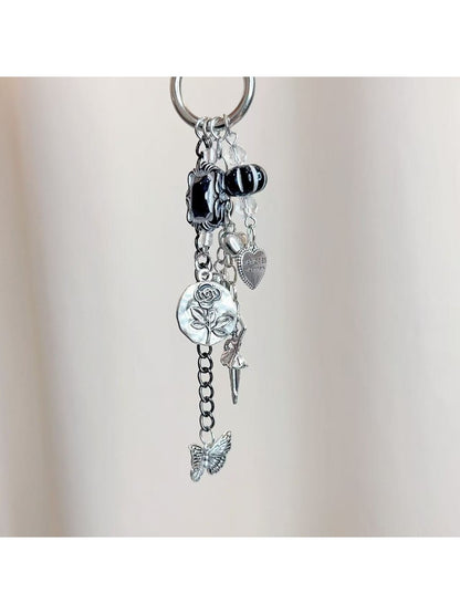 Dancing girl charm keychain attached to a set of keys