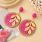 Earedge round leaf pendant earrings worn on a model's ear