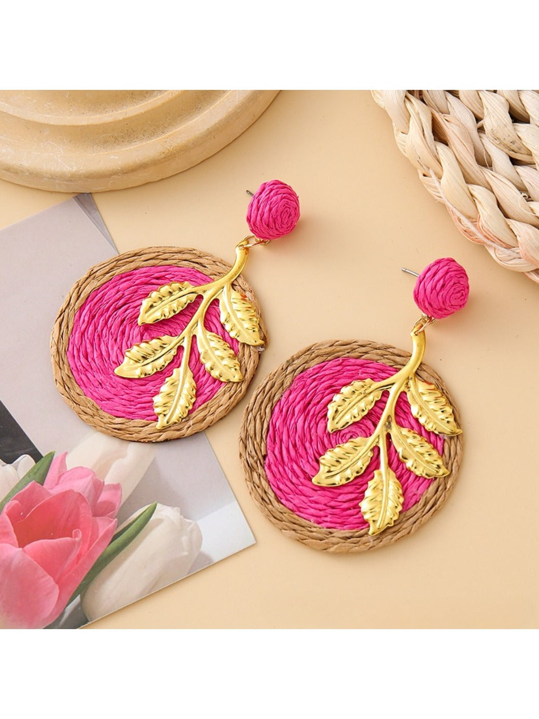 Earedge round leaf pendant earrings worn on a model's ear