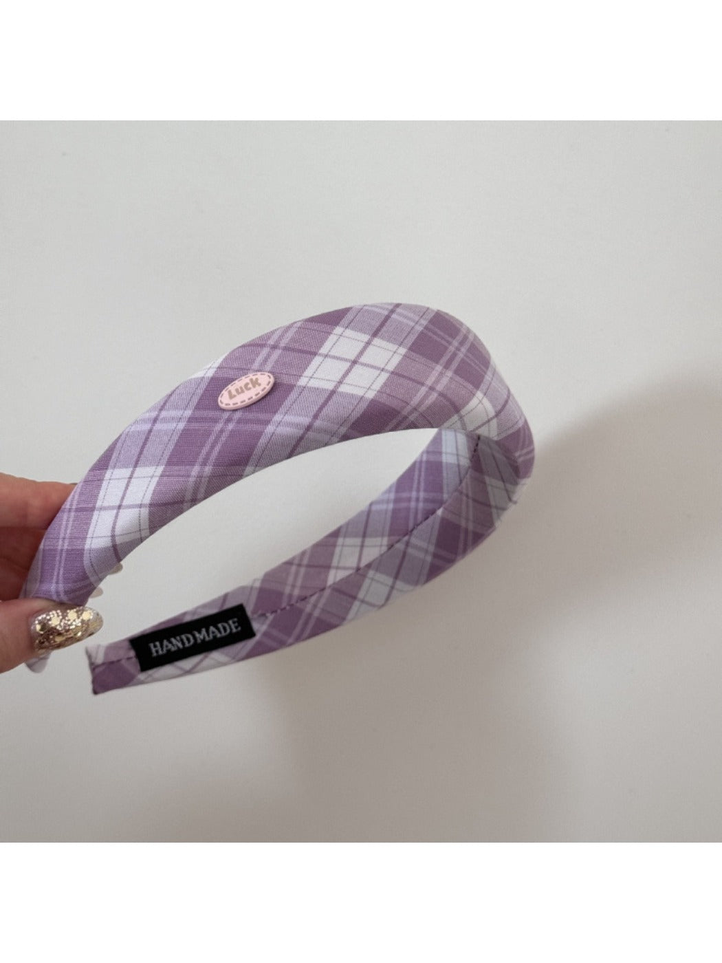 Close-up of Gifty Sweet Plaid headband showing fabric texture and wide edge design