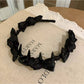 Top view of Gifty satin polka dot bow headband highlighting bow shape