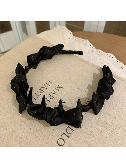 Top view of Gifty satin polka dot bow headband highlighting bow shape