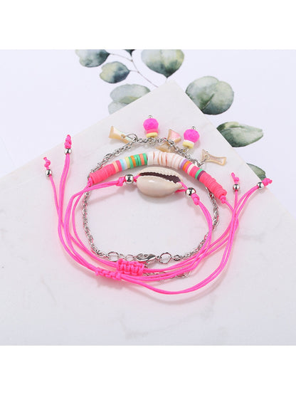 Lovra Earedge Ocean Style multi-row bracelet coiled to display its ocean-inspired design and colors