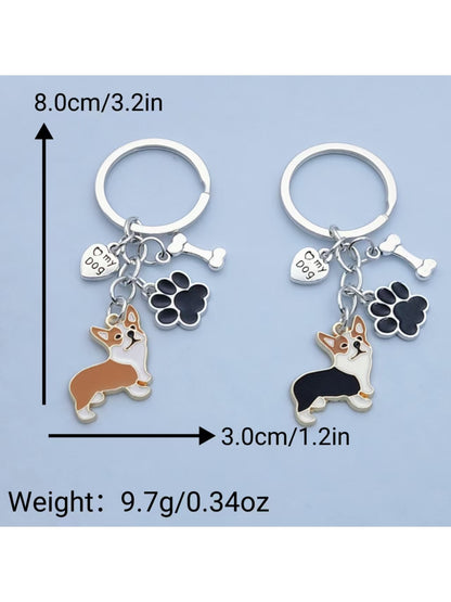 Both puppy and puppy paw keychains displayed on a wooden surface