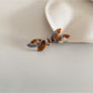 Beau retro bow hair clip angled to show glossy acetate finish