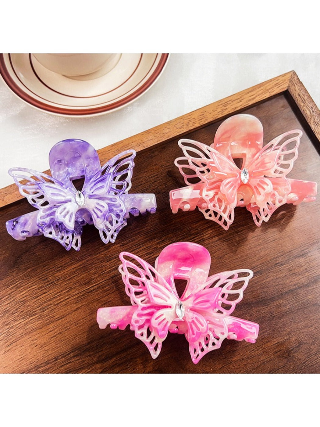 Side view of Beau butterfly decorated hair claw clip showing clasp mechanism