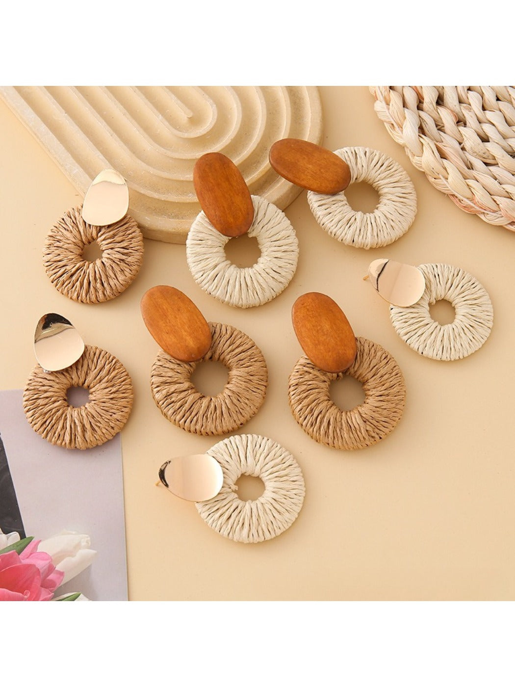 Close-up of Earedge elegant round drop earrings with silver finish on white background