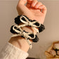 Side view of the vintage polka dot bow hair tie showing elastic band