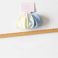 Hair ties wrapped around a wrist showcasing their stretch and minimalist design