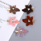 Beau chic leaf shaped hair clip in gold metal with detailed veins